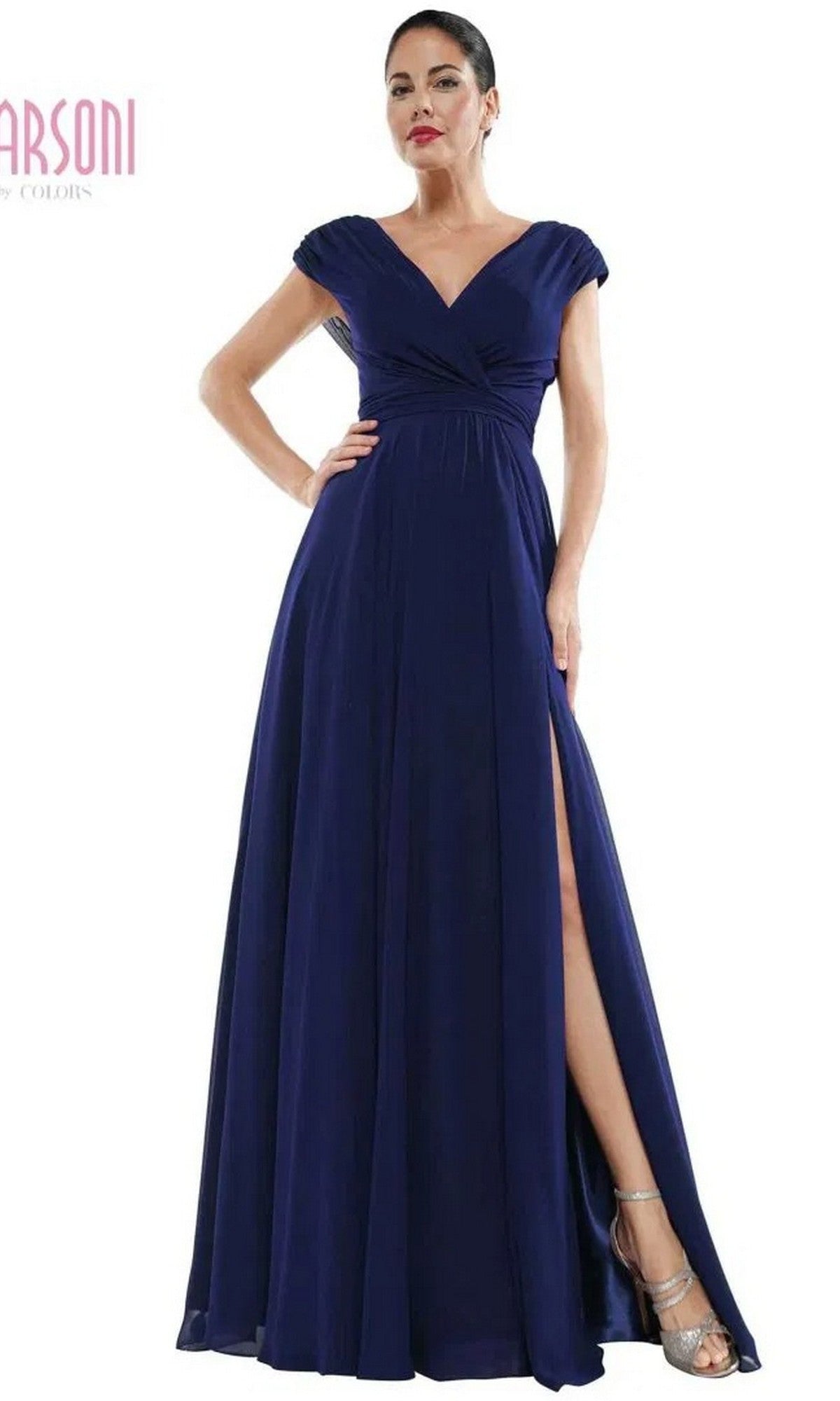 A woman models the Marsoni M251, a navy long formal dress with a V-neckline, cap sleeves, and a high leg slit, standing against a white background.